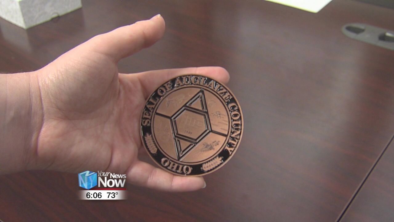 Auglaize County Commissioners unveil 50th Anniversary medallion1.jpg